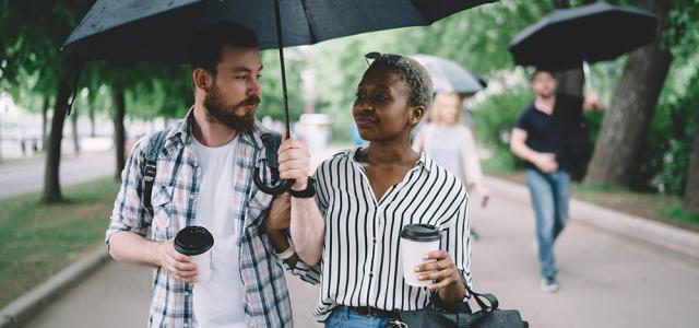 couple sharing an umbrella